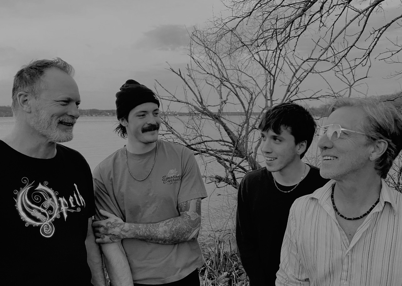 BURNT McMELBA TOAST band members by the river